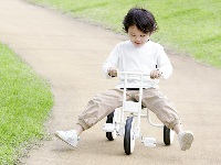 Boy on Tricycle beginner learning